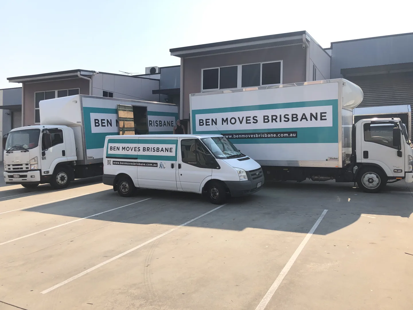 Ben Moves Brisbane moving trucks and van parked together outside the depot