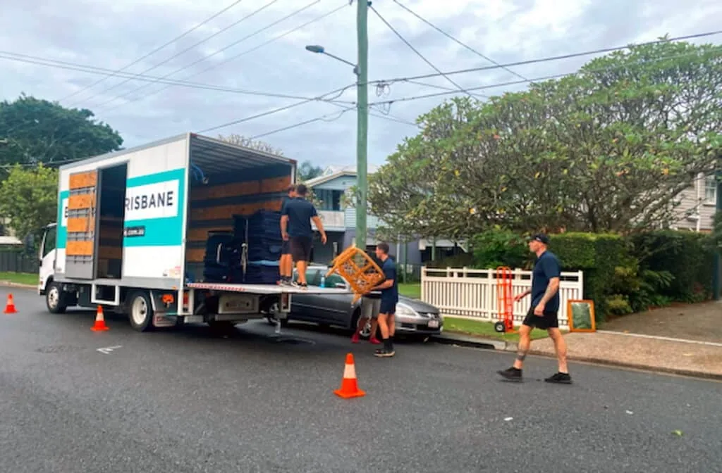 Ben Moves Brisbane removalists loading furniture beside a moving truck