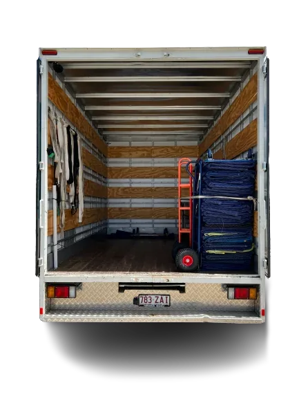 Truck loading area with stacked removal pads and a trolley